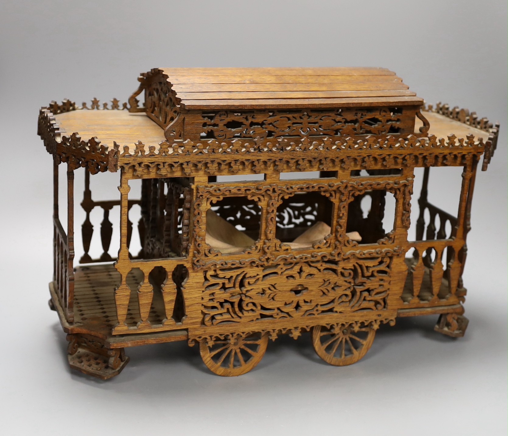 An early 20th century fretwork model of an American street car, 45cm